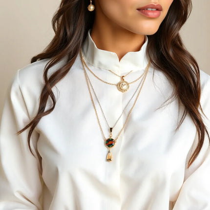 Layered unique necklaces with pendants and charms displayed on a model in soft daylight