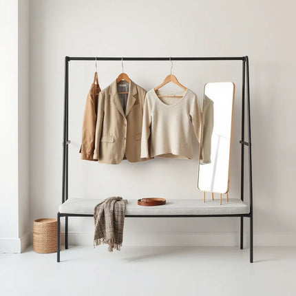 Neatly arranged calm-toned clothing pieces on a minimalist wardrobe rack with soft natural light