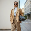 Stylish person wearing a bold coordinated outfit with statement accessories in natural daylight