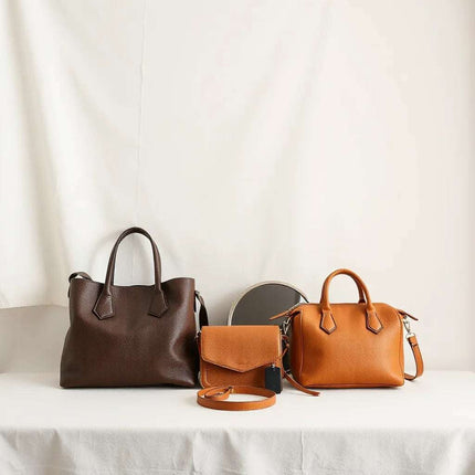 Stylish handbags in tote, crossbody, and structured styles arranged neatly on a light neutral background