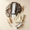Neutral wardrobe essentials arranged on a light background for an easy style refresh