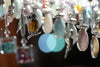 A close up of a wind chime with an owl on it